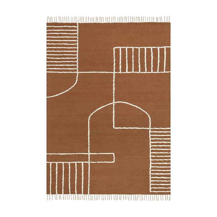  light brown rug with white emroidery