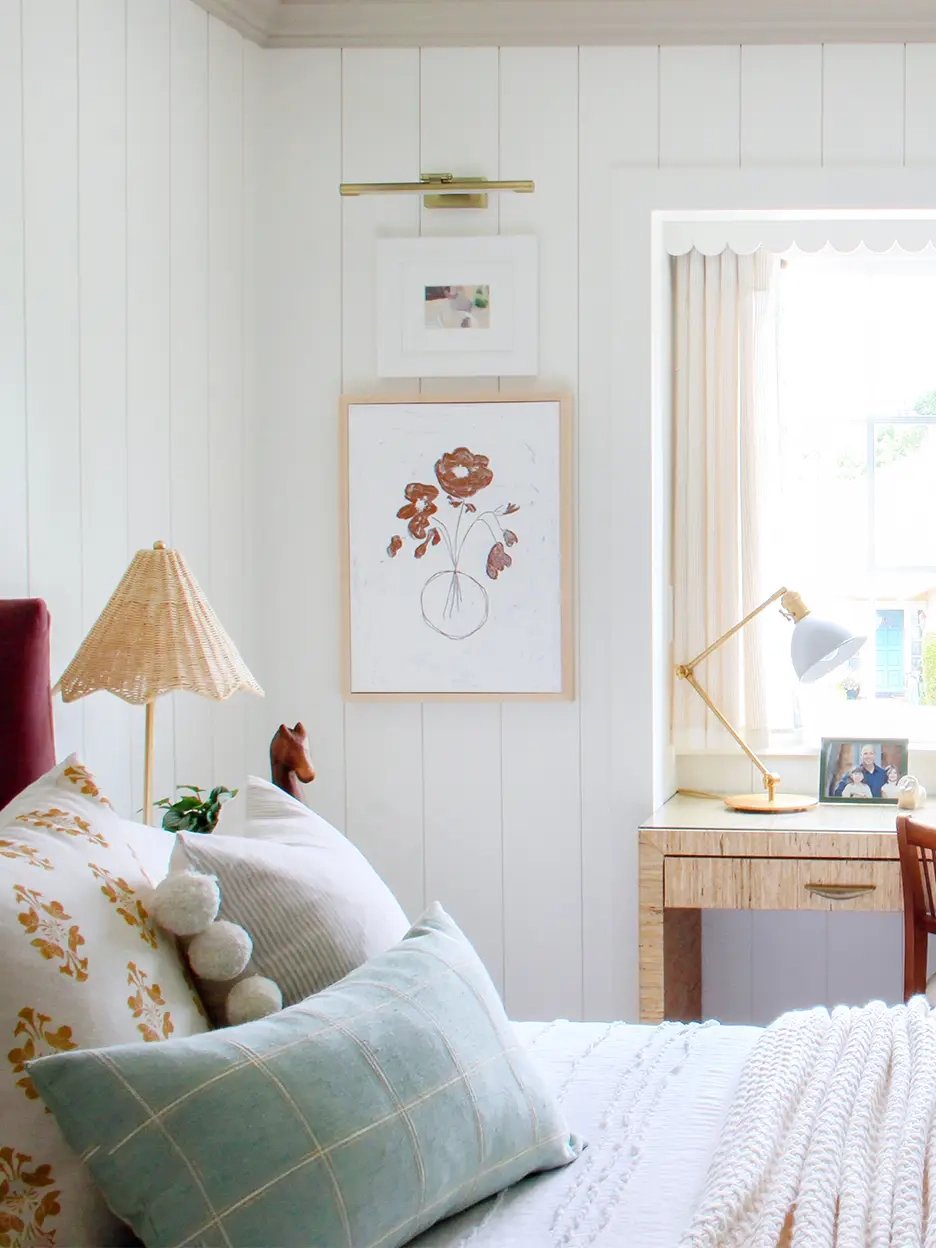 Teen room with wicker lamp and white shiplap lining the wall.