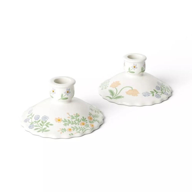  set of white floral candlestick holders