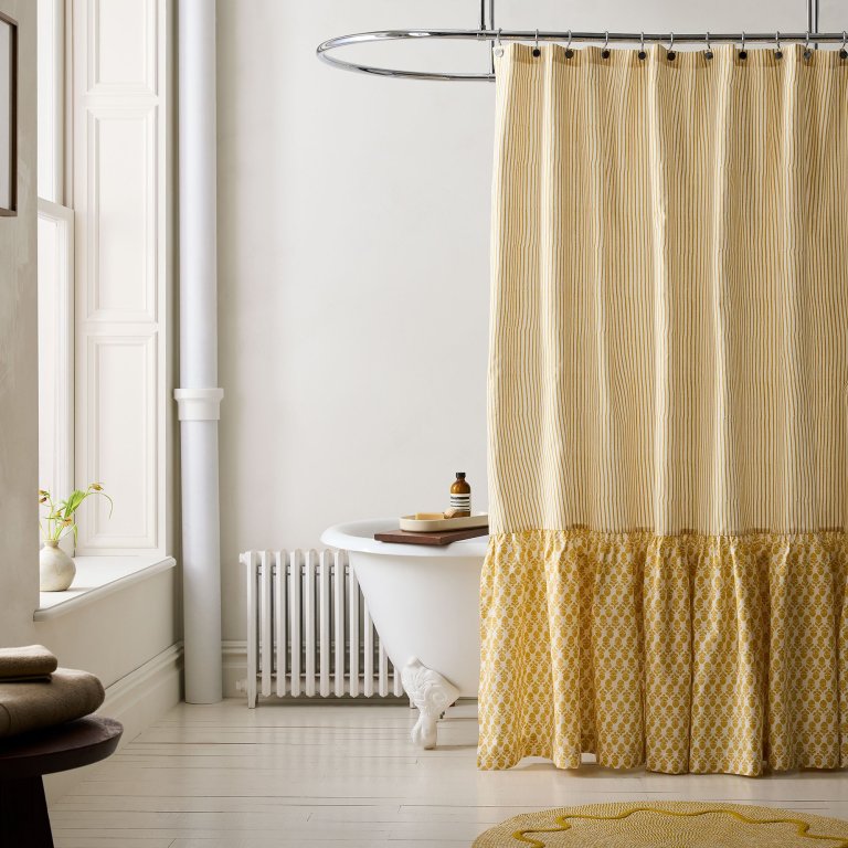  yellow striped and ruffled shower curtain