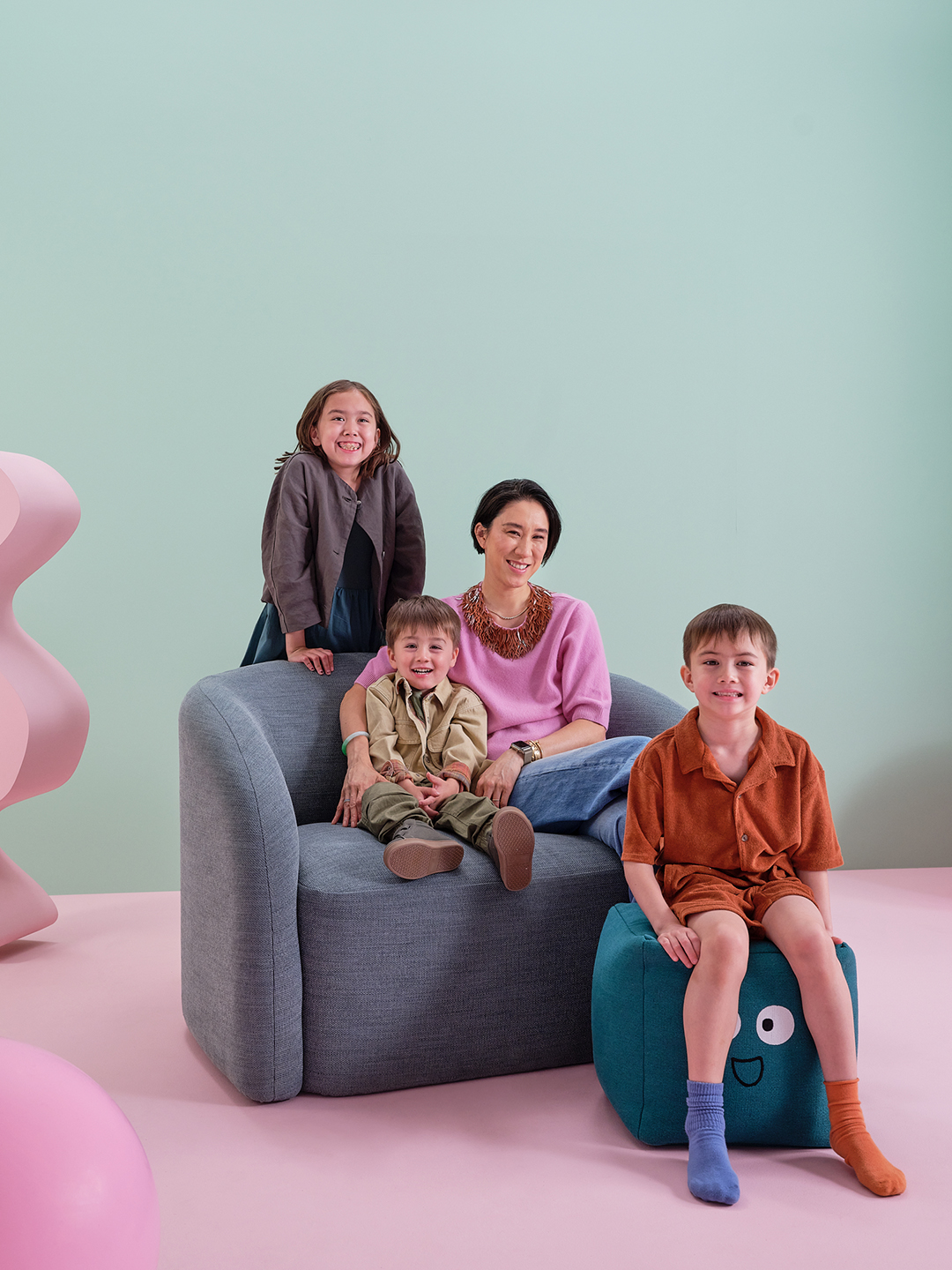 woman with kids on blue chair