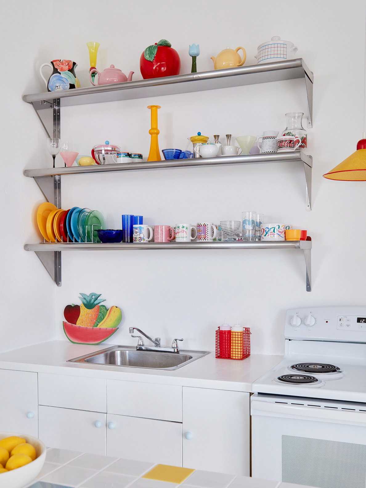 Metal shelving with colorful dishware
