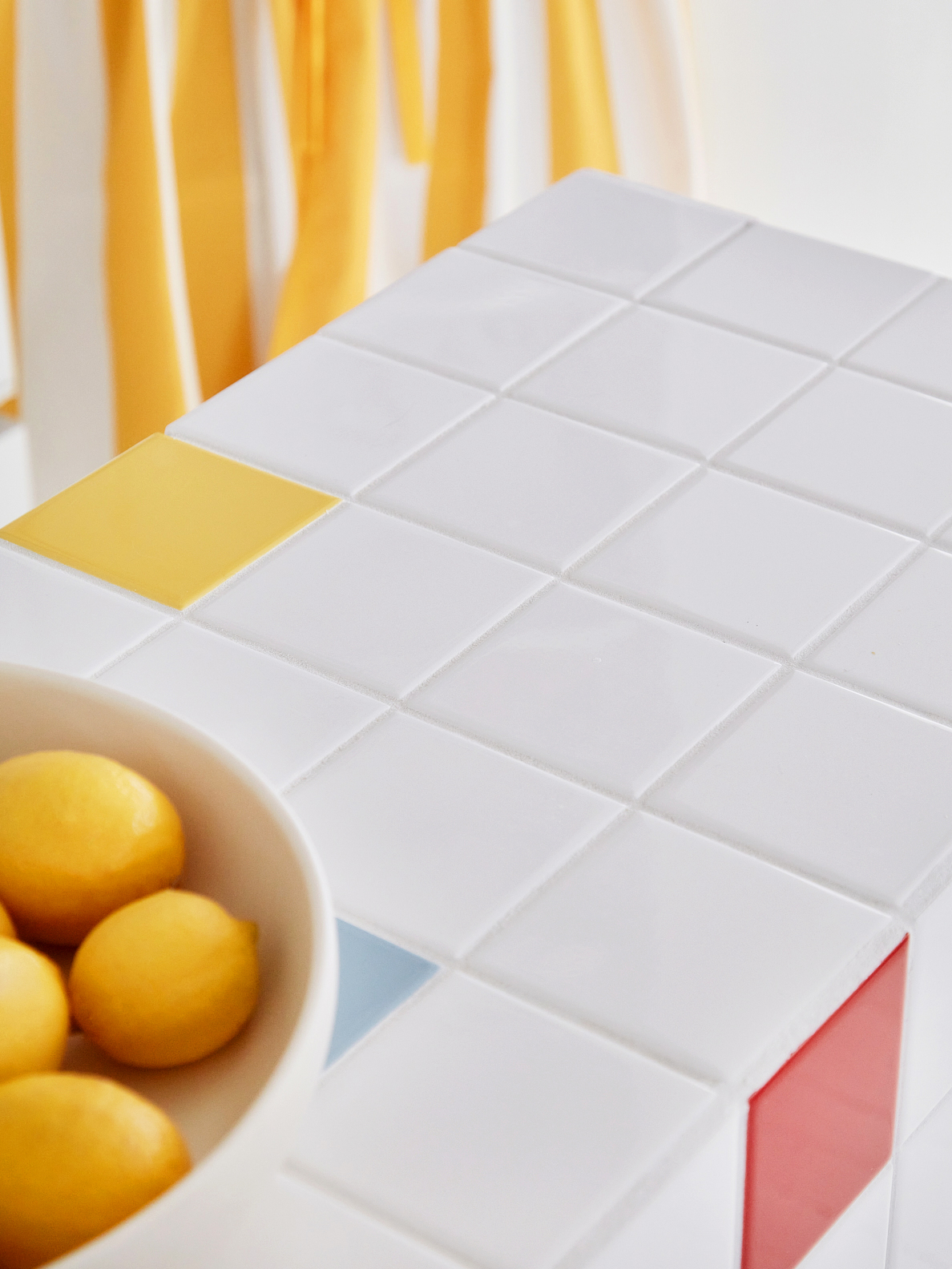 White tile with primary color accent tiles