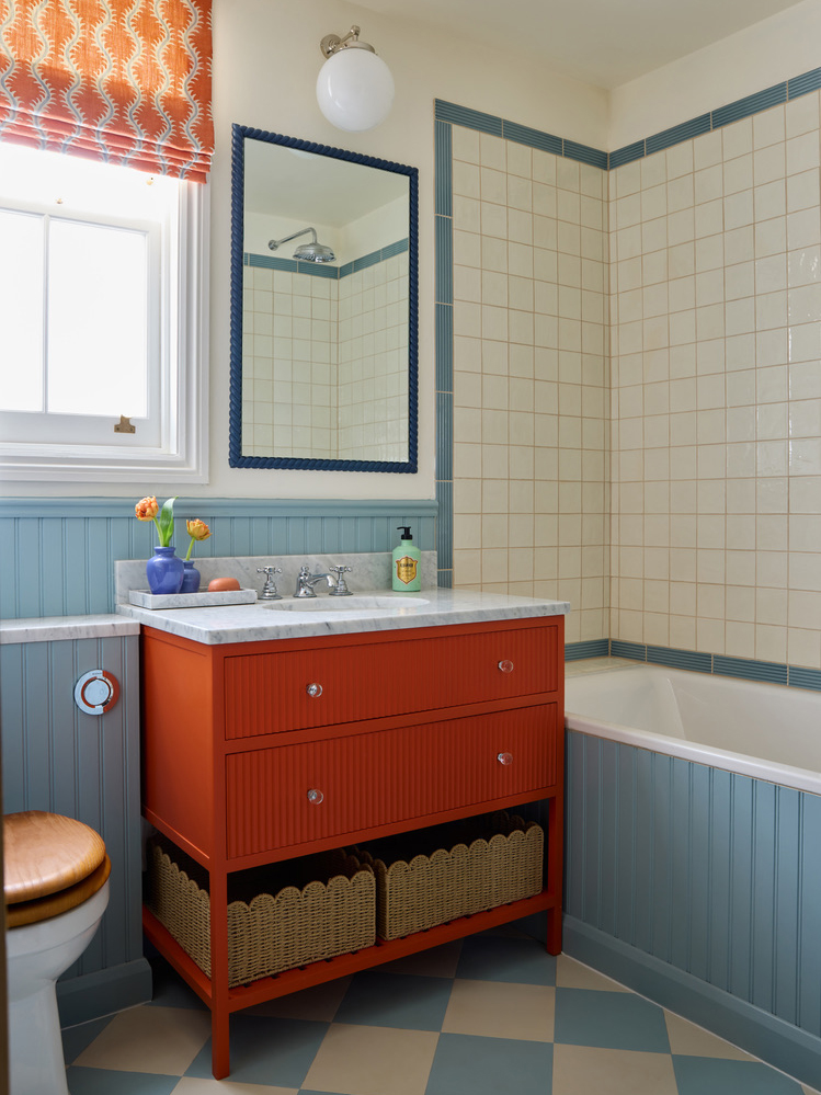 red bathroom vanity and blue walls