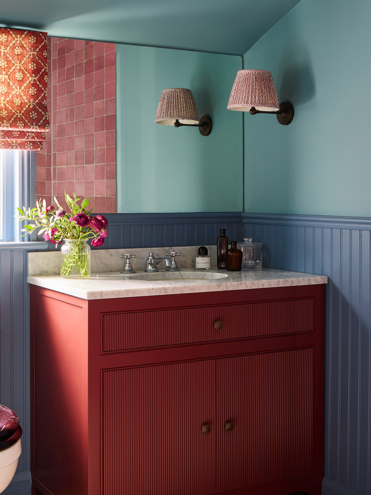 red bathroom vanity and blue walls