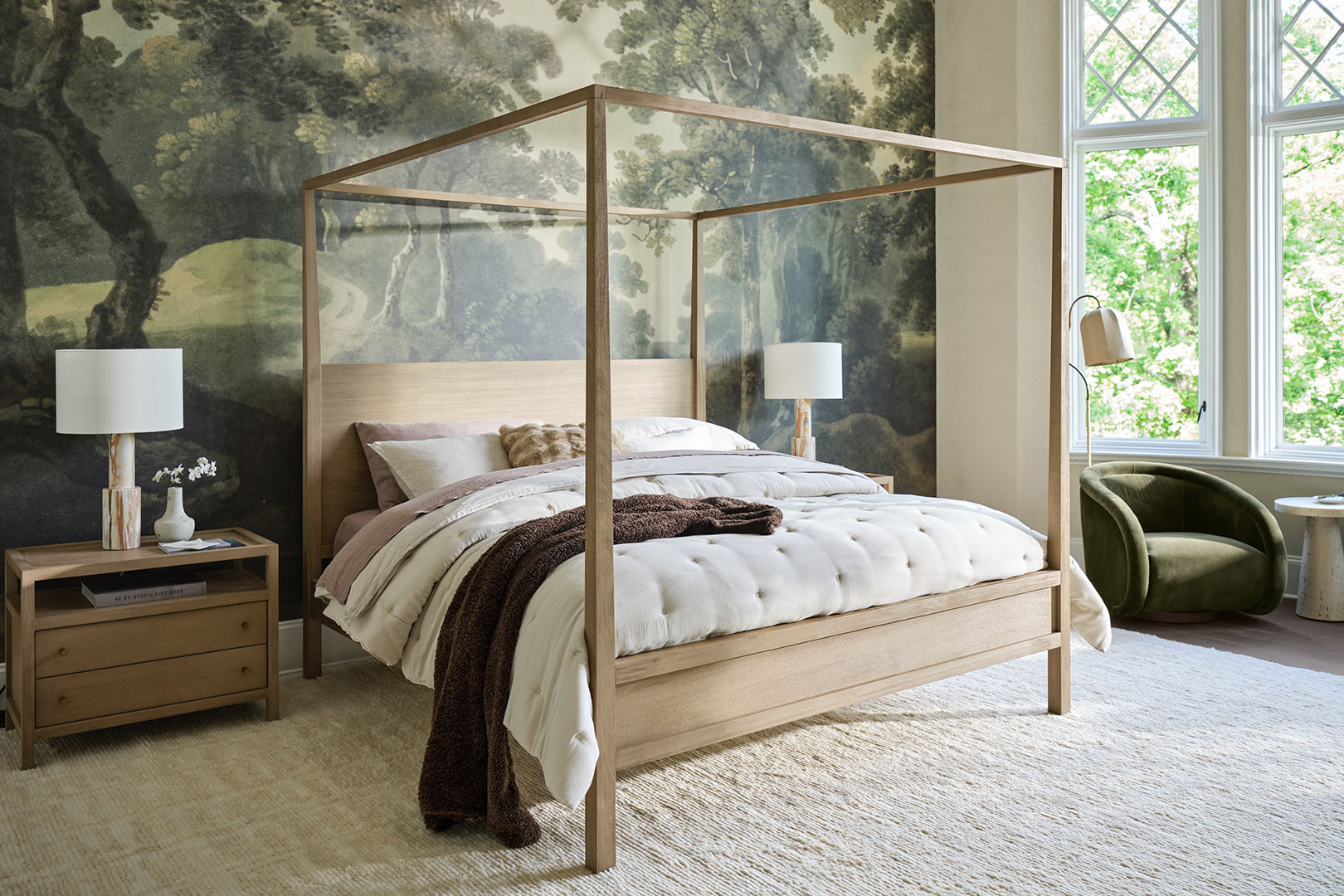 Bedroom with canopy bed and forest wallpaper