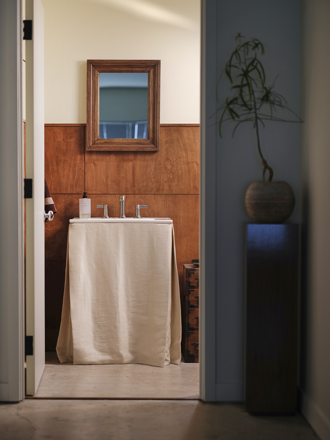 For Less Than $5K, This Designer Swapped a Cobalt Bathroom For British-Inspired Wood Paneling