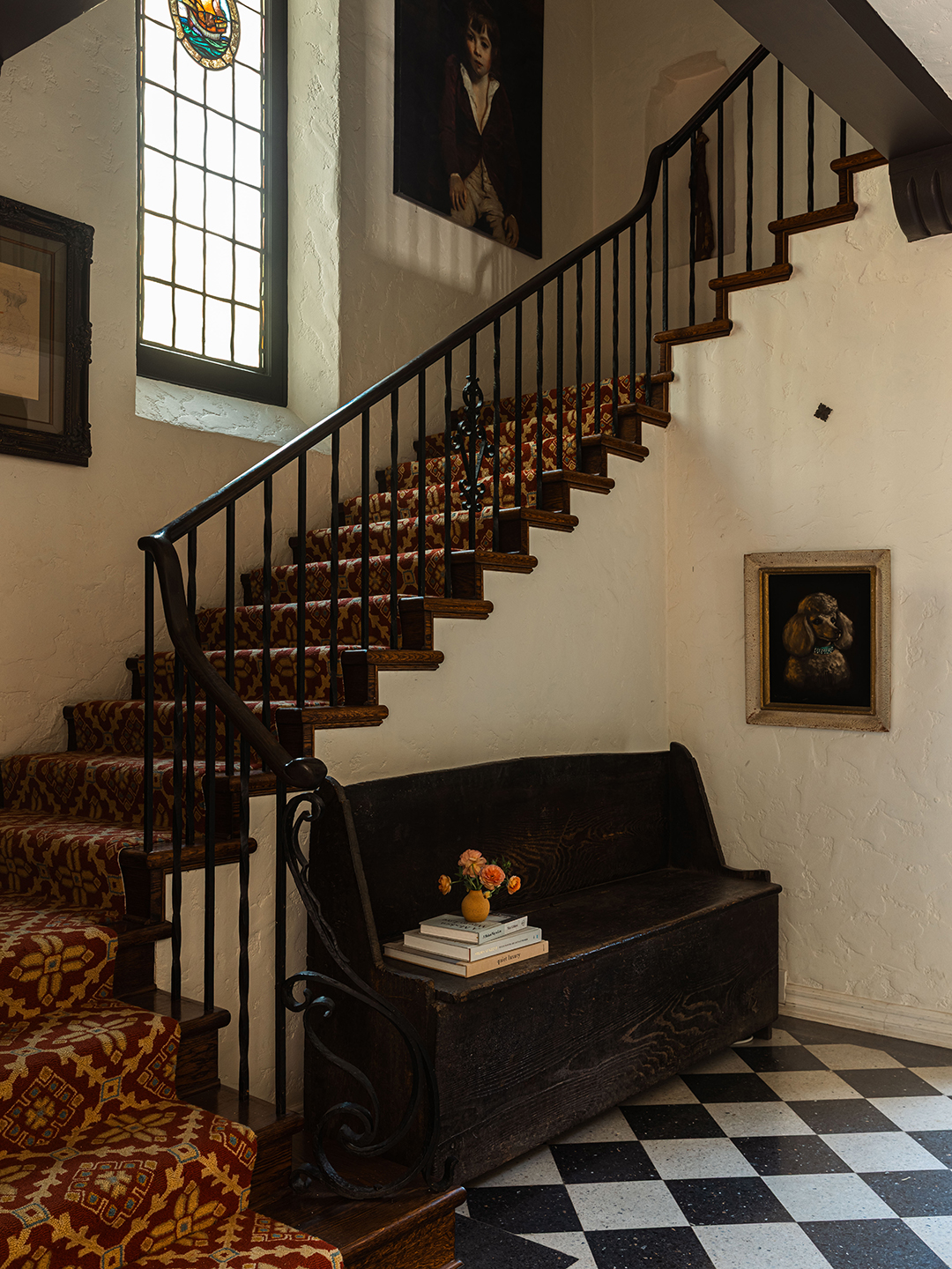 Entryway with wrought-iron staircase