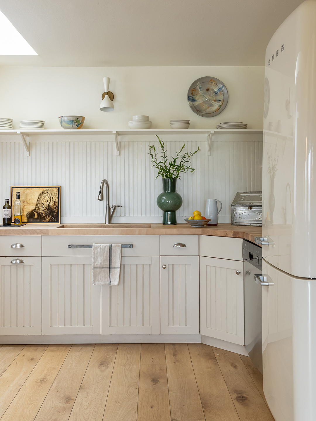 Off white kitchen with open shelving 