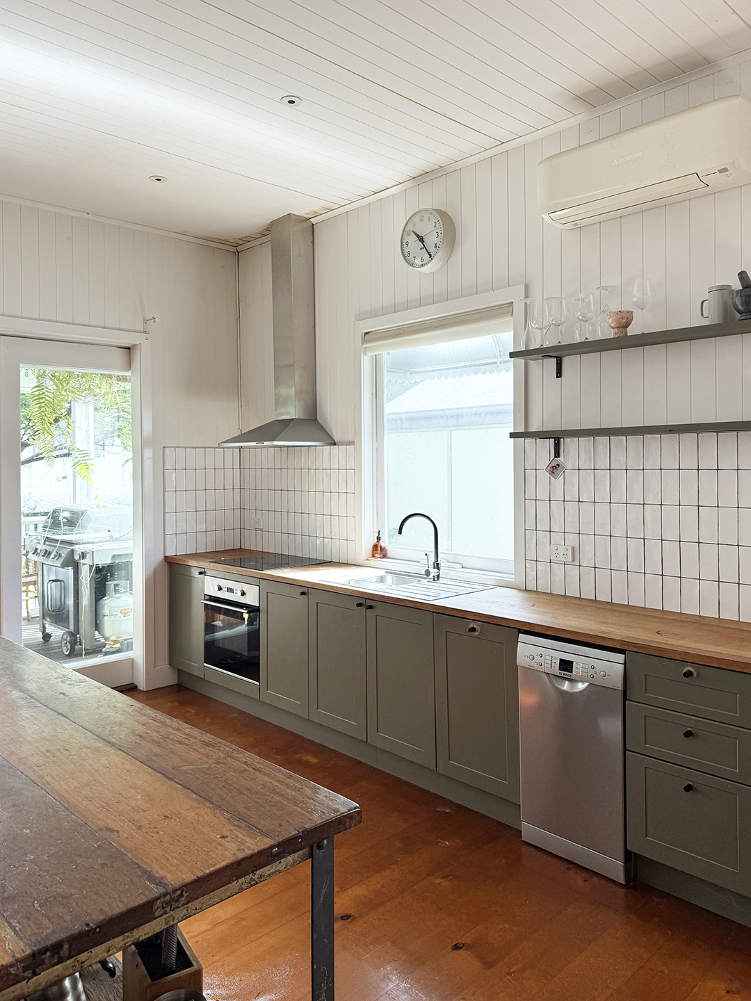 Kitchen with green cabinets