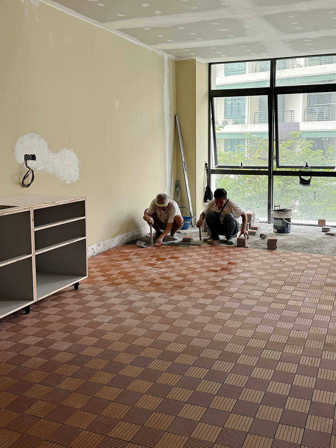 The tile floors being laid