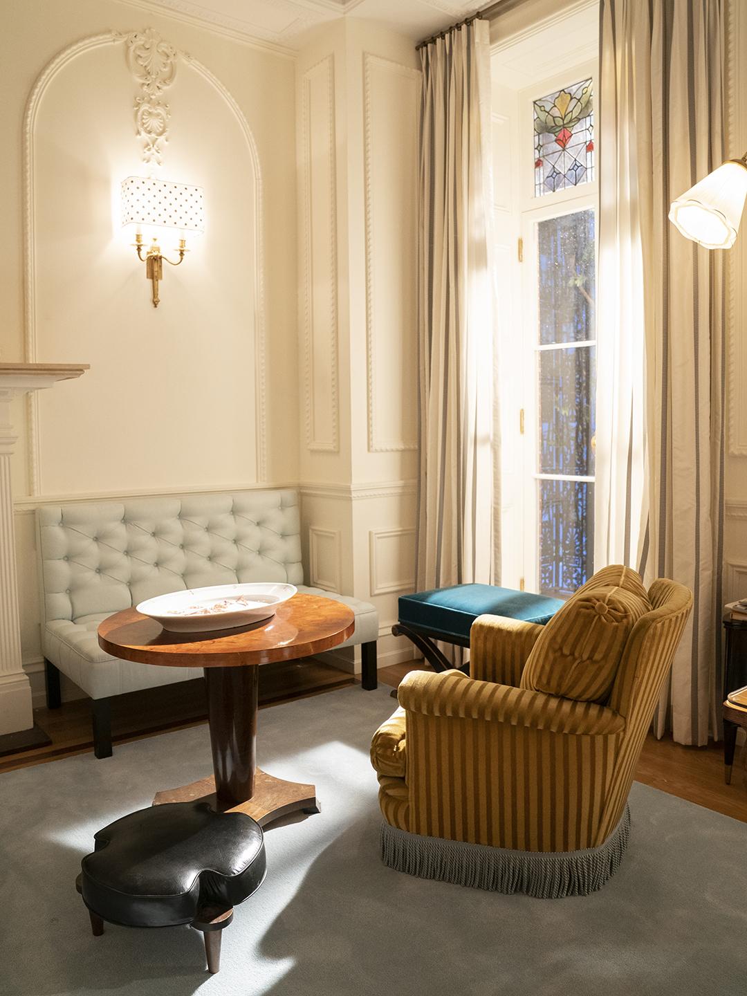 Carrie Bradshaw's townhouse white living room with multiple colored seating