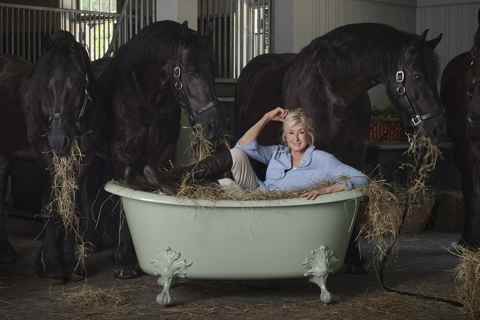Martha Stewart in a tub in her stables