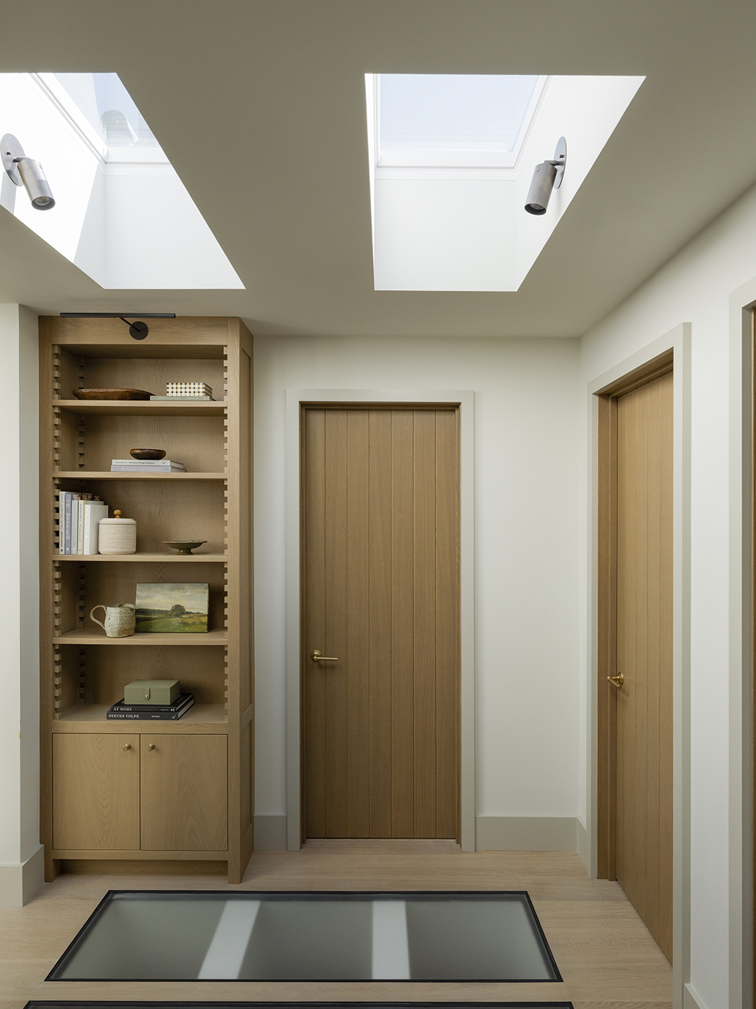 hallway with skylight in the floor
