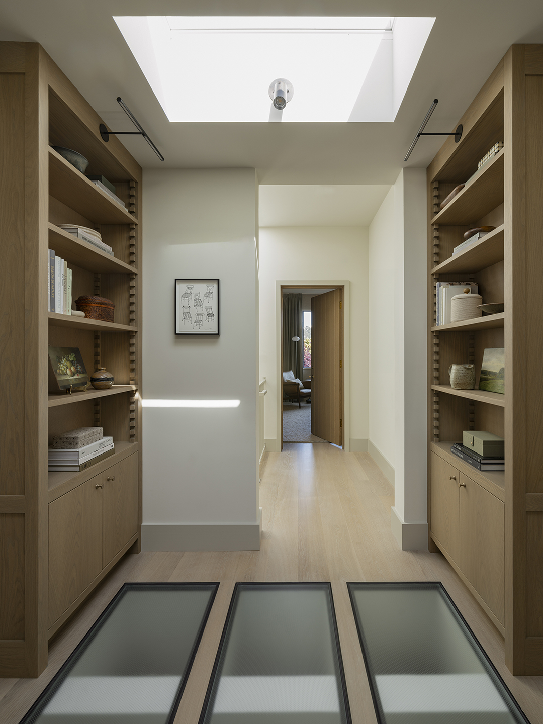 hallway with skylight in the floor