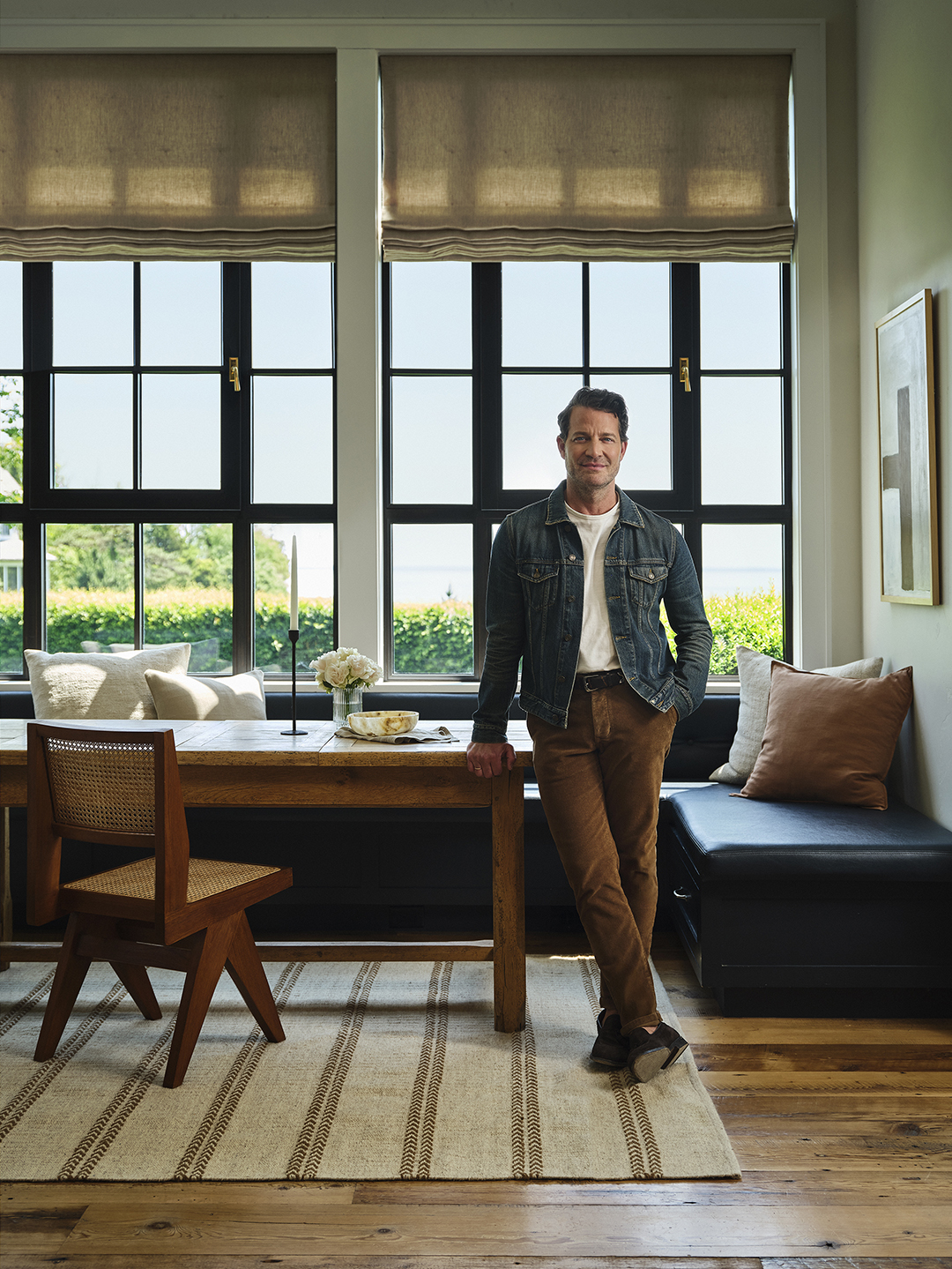 man leaning on table