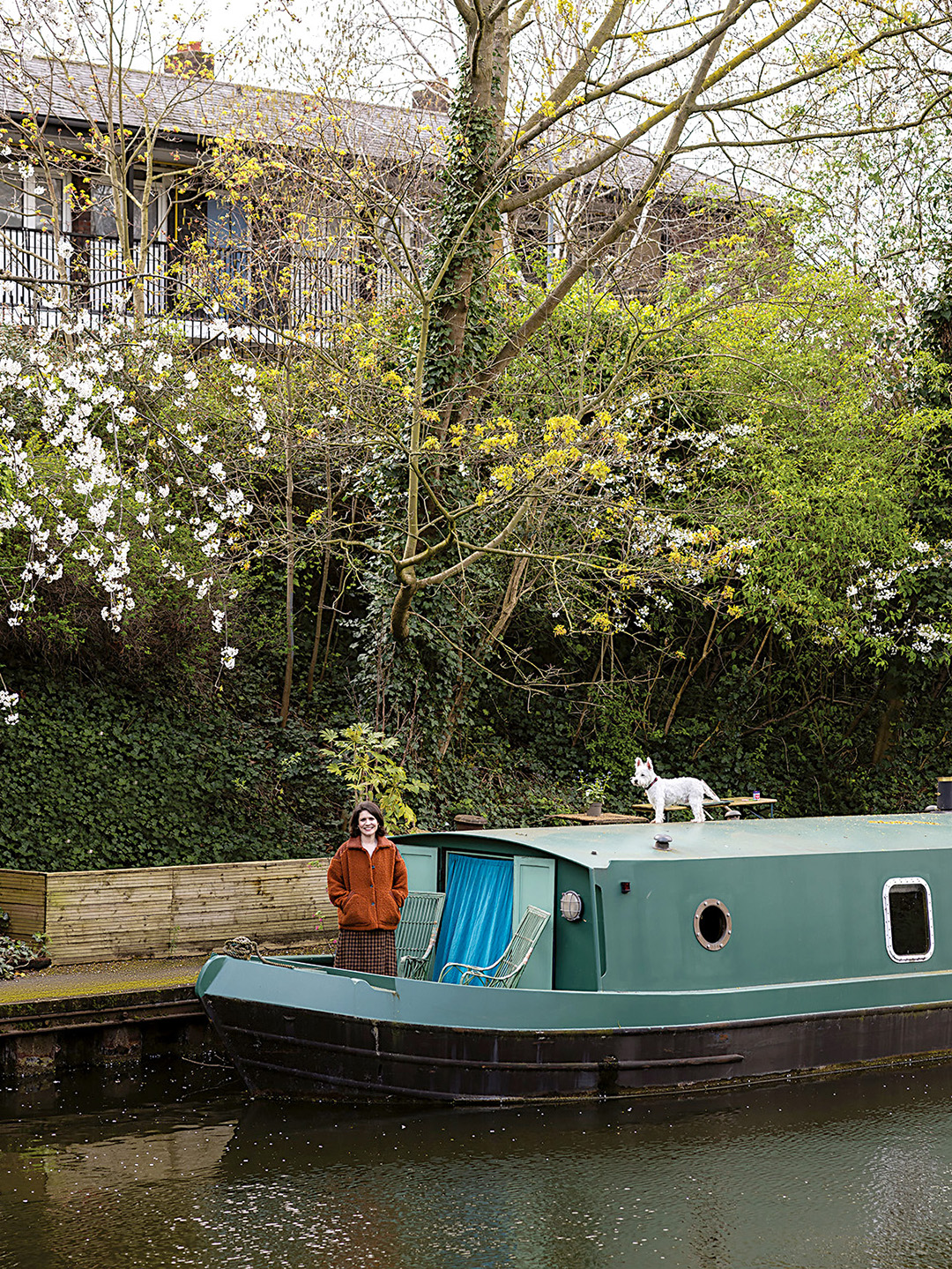 woman and dog on house boat