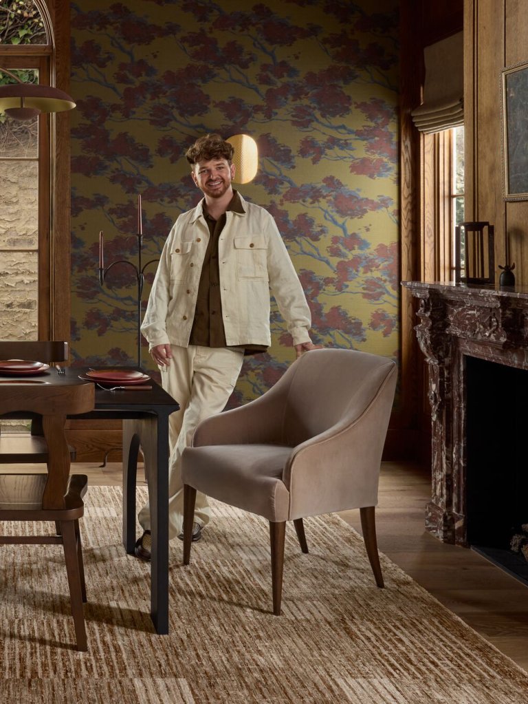 man leaning on chair