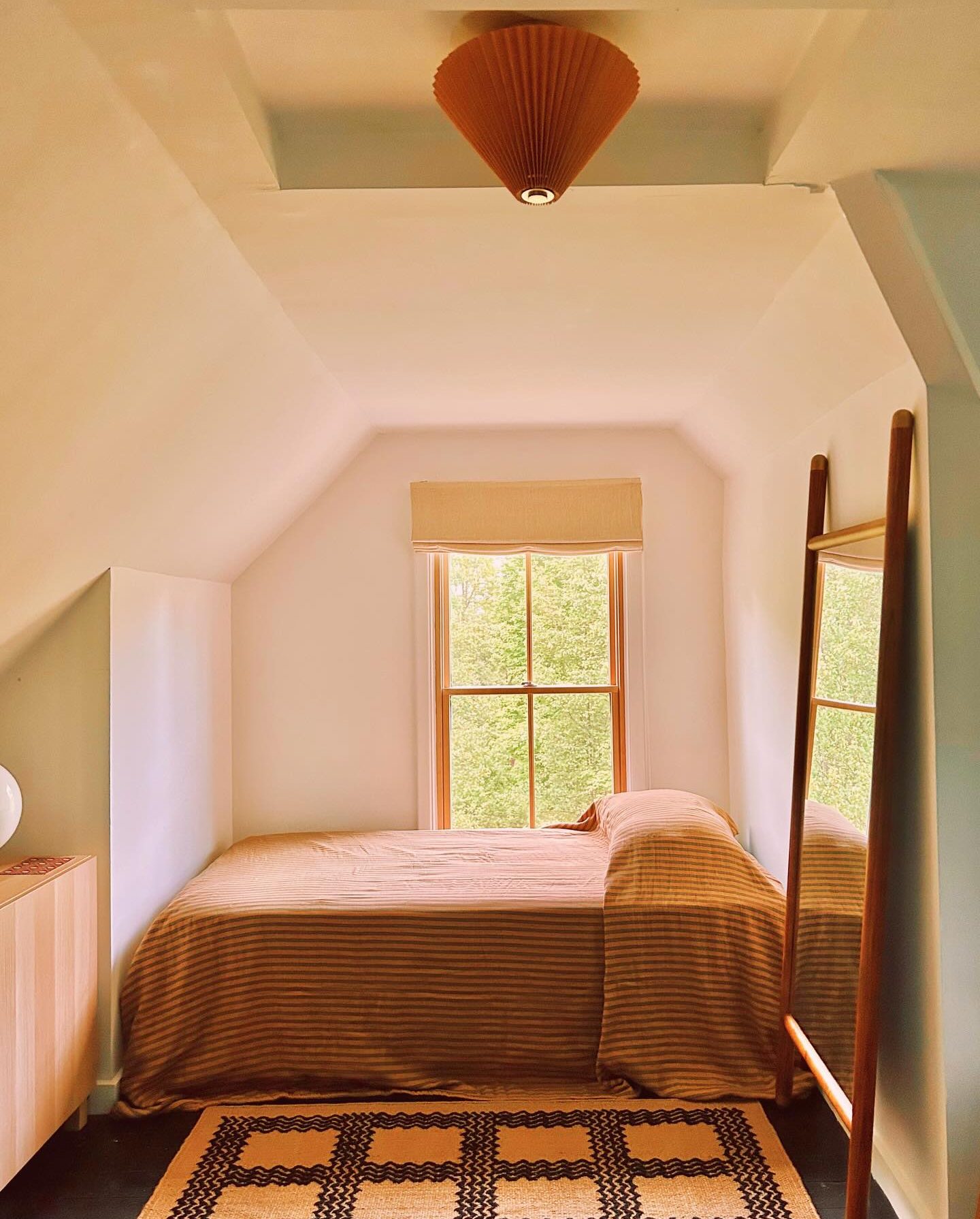 bedroom with angled ceilings