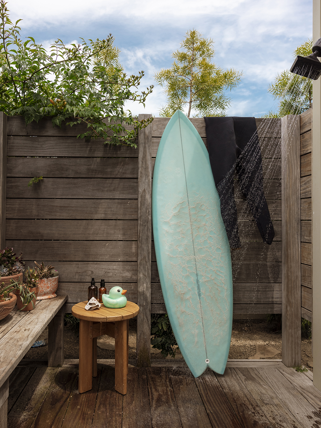 surf board in outdoor shower