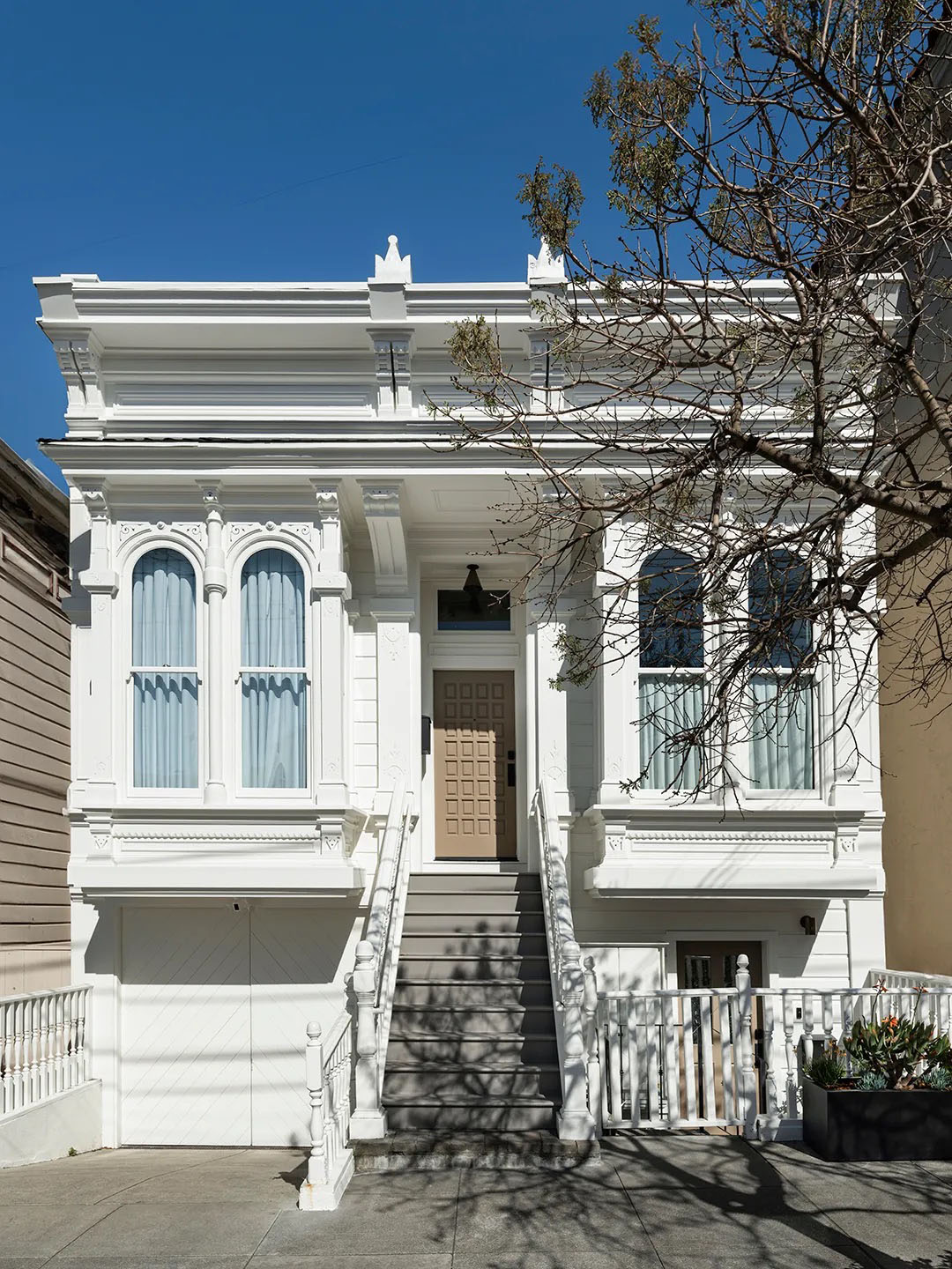 white hosue with beige door