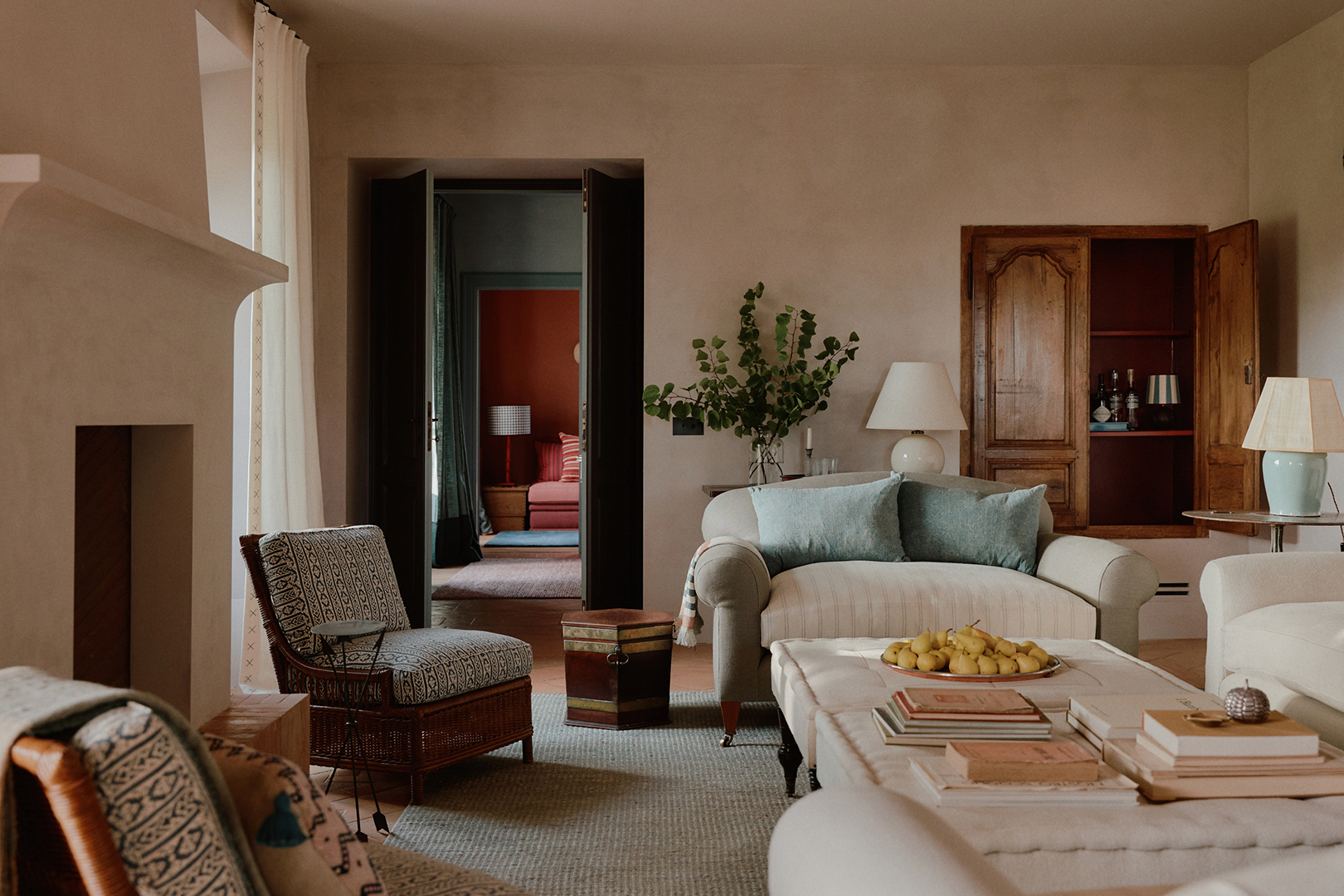 Living room with stucco walls and upholstered chairs and sofas