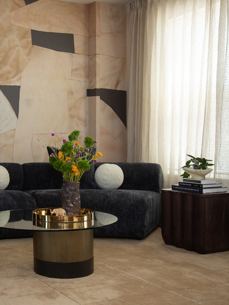 curved sofa with accent wallpaper