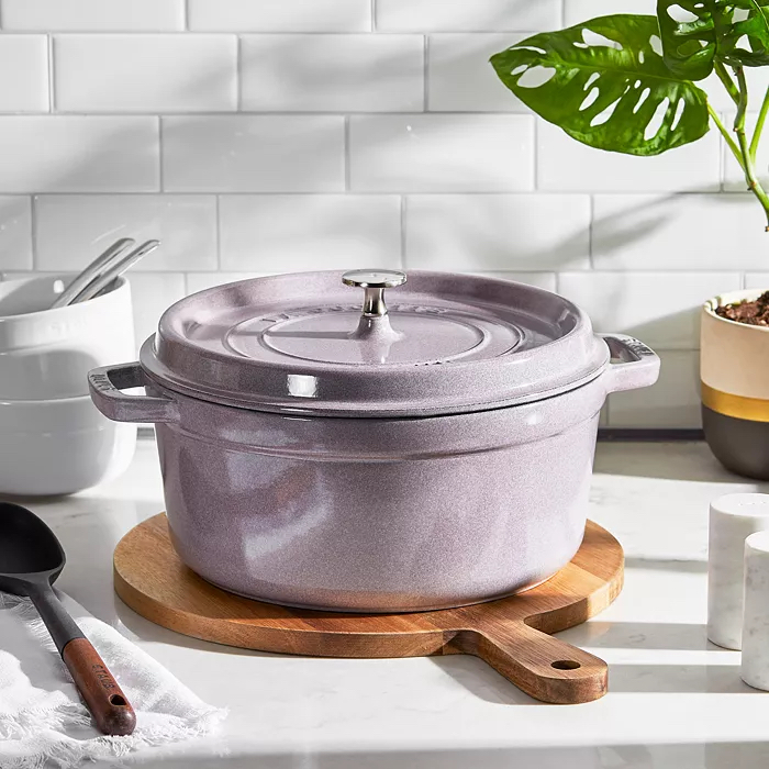 Lilac-colored Dutch oven in white kitchen.