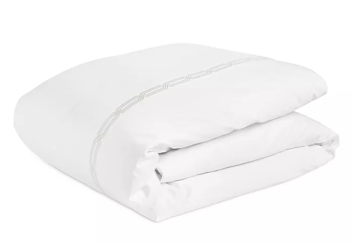  Folded white duvet cover on white background.