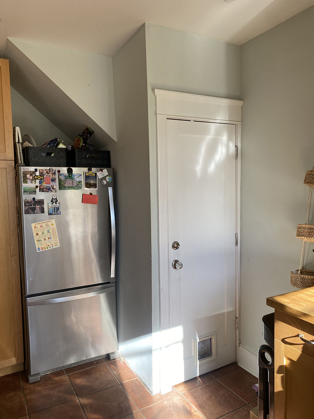 fridge under stairs