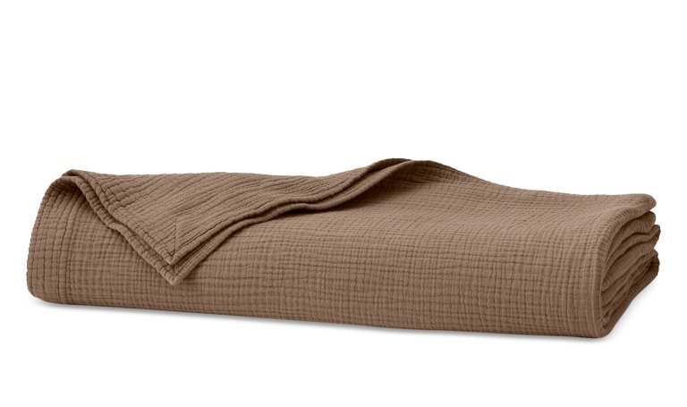  Brown cotton voile throw folded.