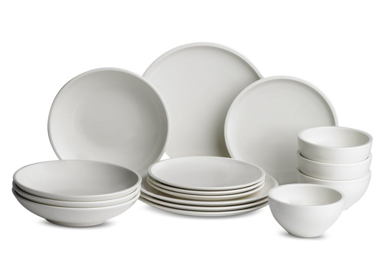  16-piece white porcelain dinnerware set against white background.