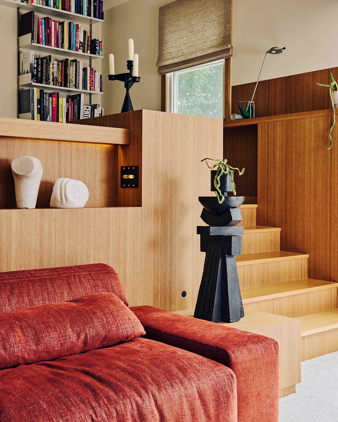 red sofa below partition