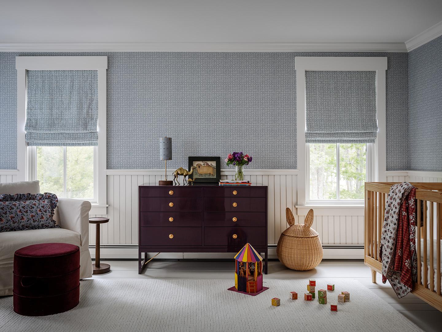 blue wallpapered nursery