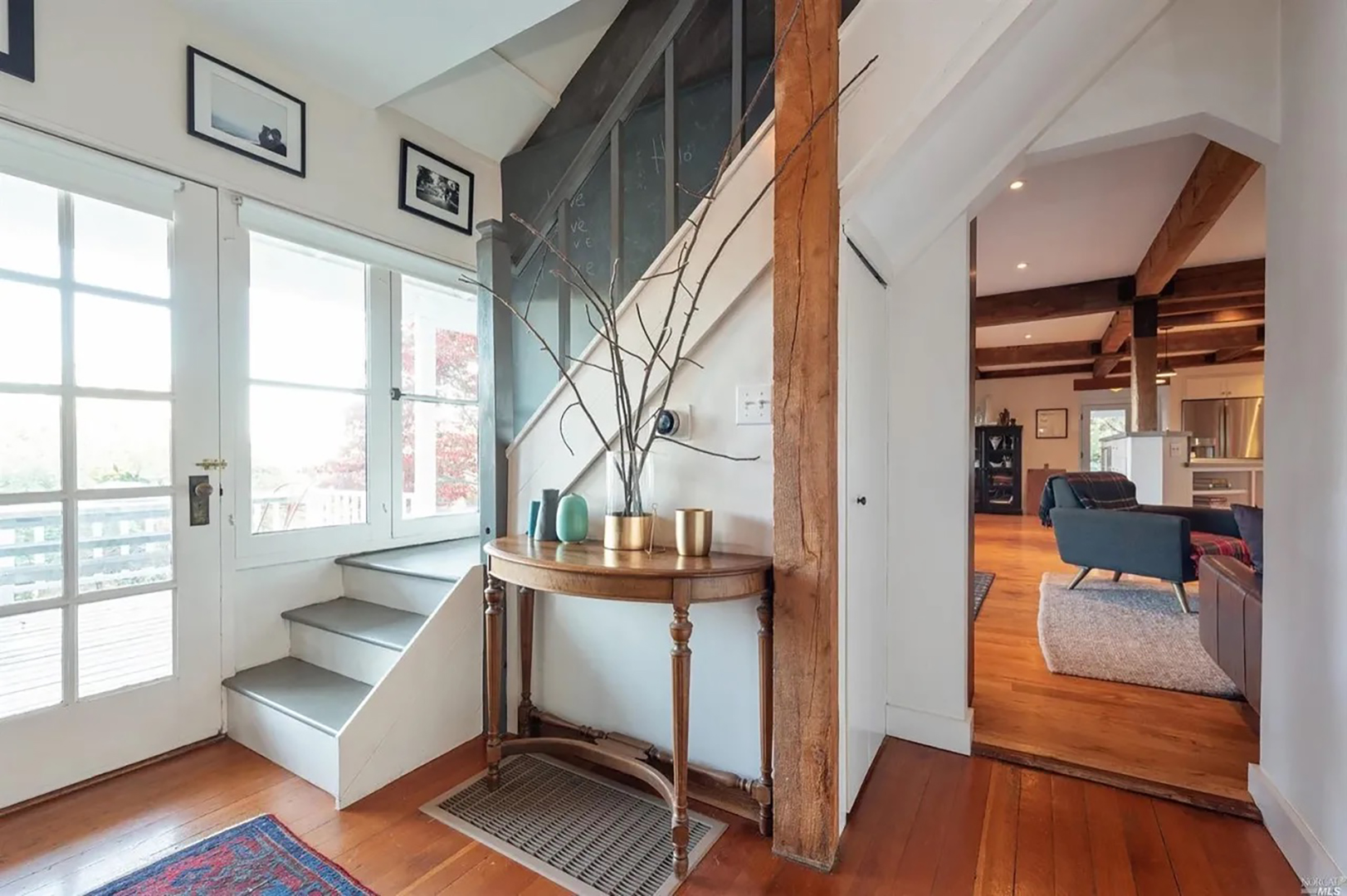 table in front of stairwell wall