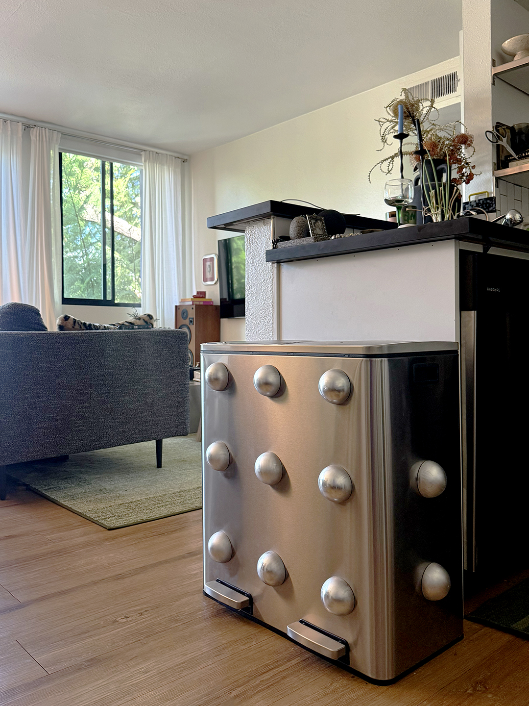 stainless steel trash can with silver knobs allover