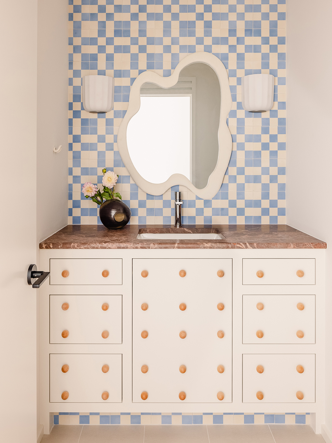 white vanity with wood knobs