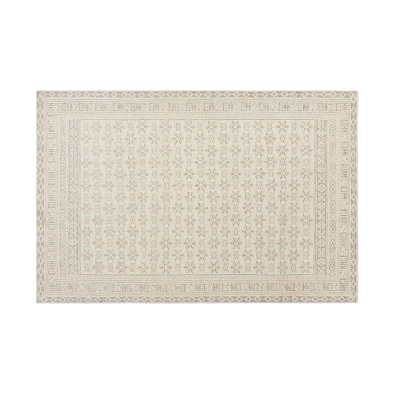  cream patterned area rug