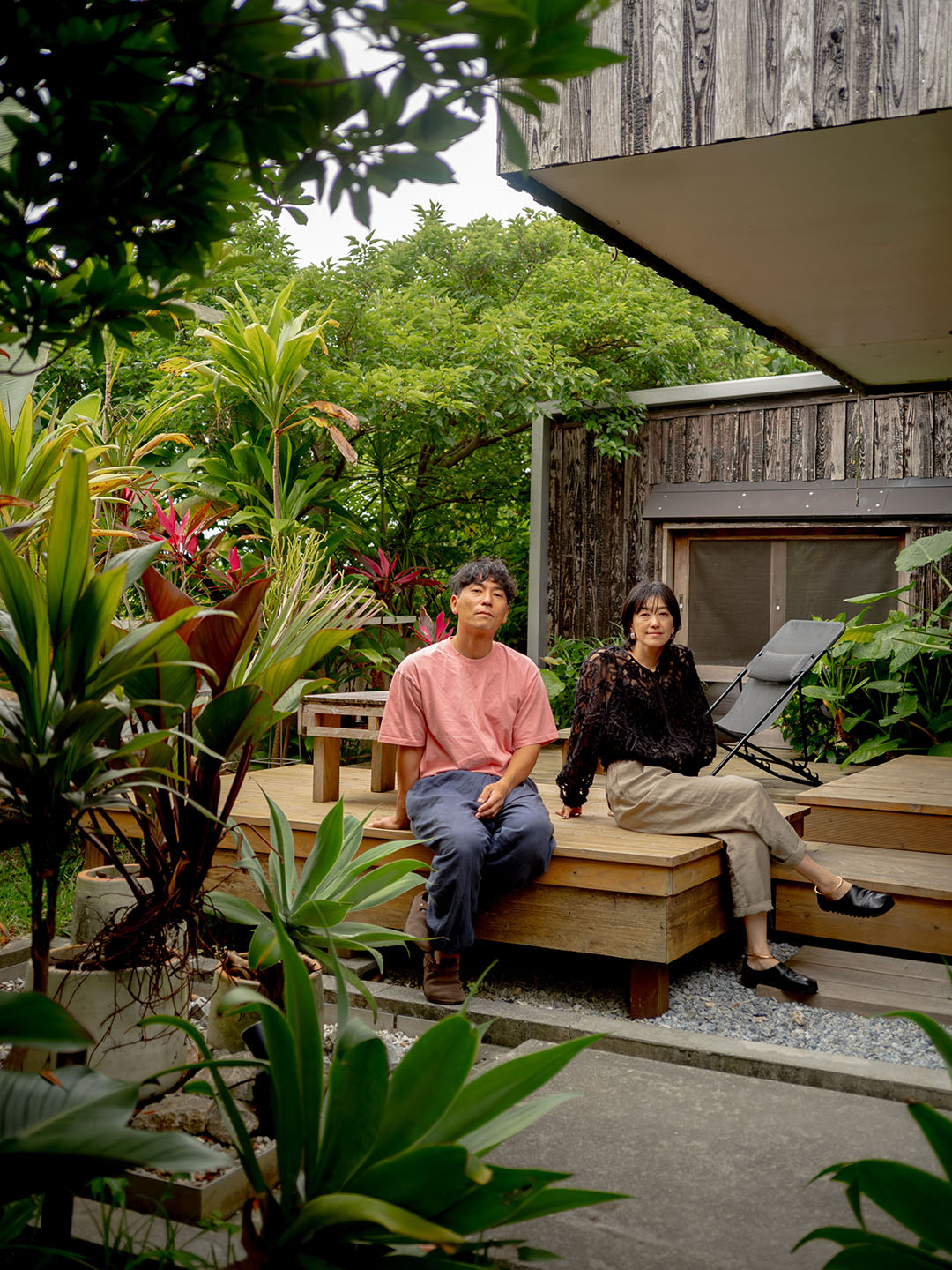 brother and sister sitting on deck