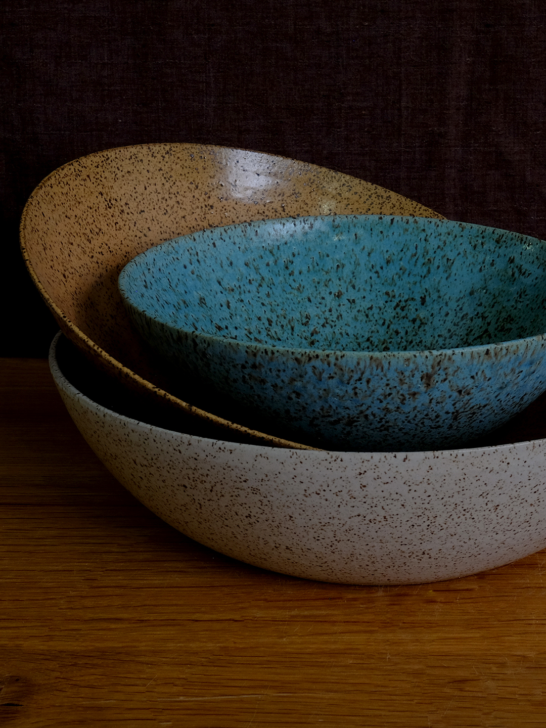 stack of ceramic bowls in different colors