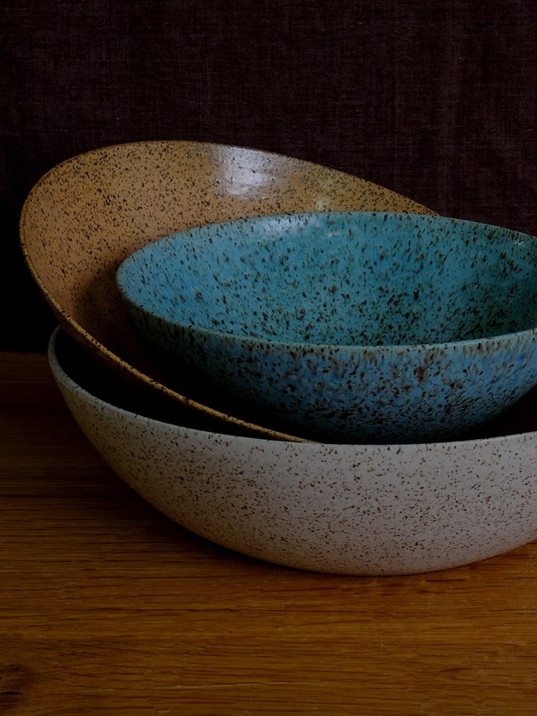 stack of ceramic bowls in different colors