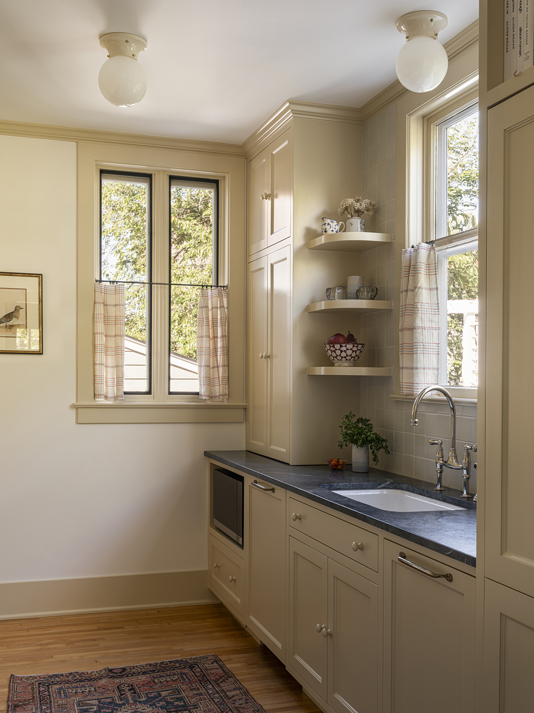 cream kitchen corner with windows and microwave