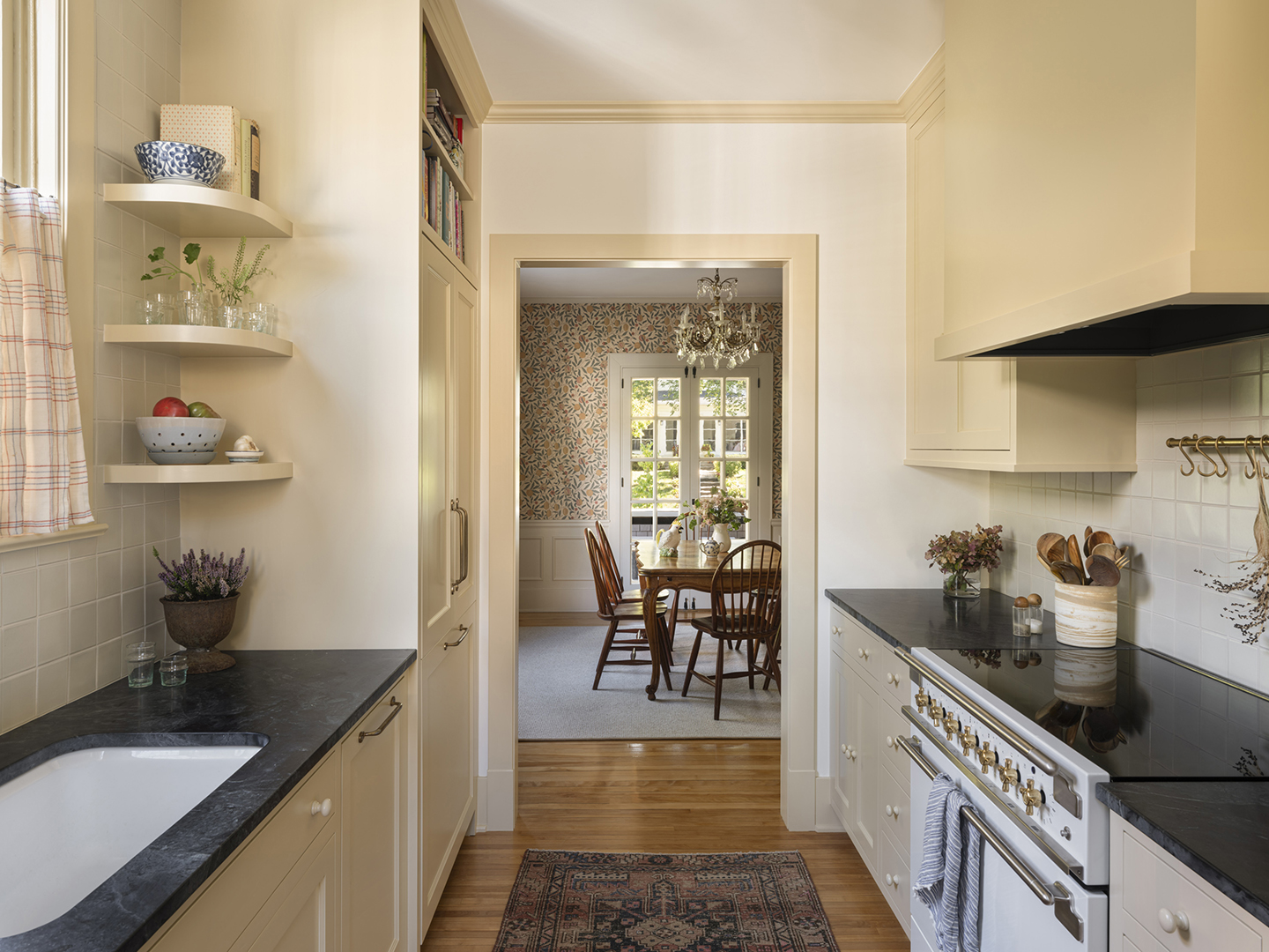 wide aisle in a kitchen leading to a dining room