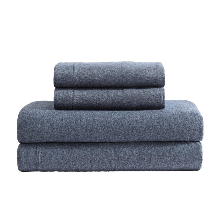  Stack of dark blue folded sheets on white background.