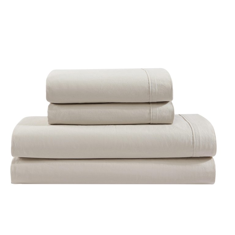  Stack of light beige folded sheets on white background.