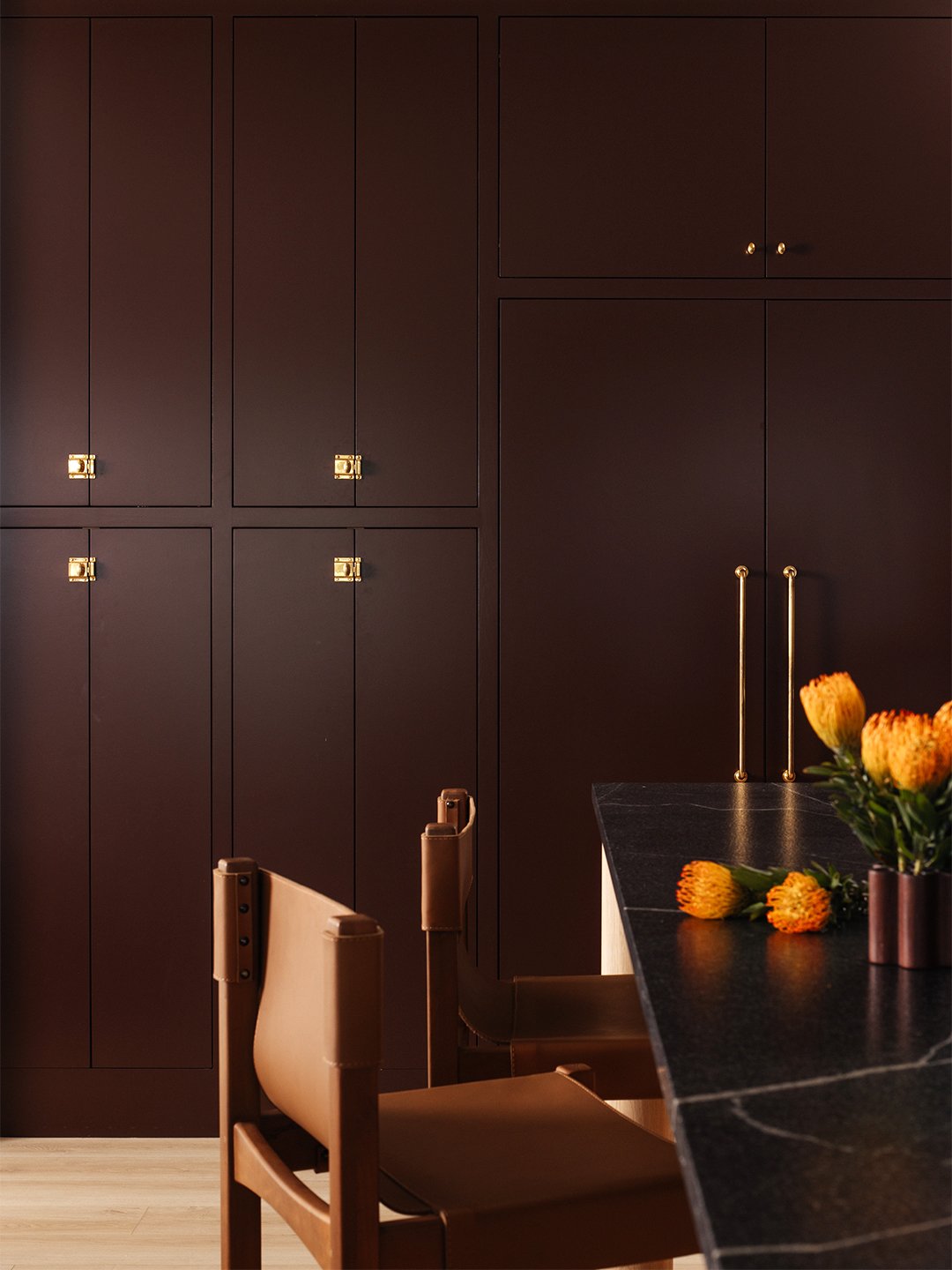 maroon/brown kitchen cabinets