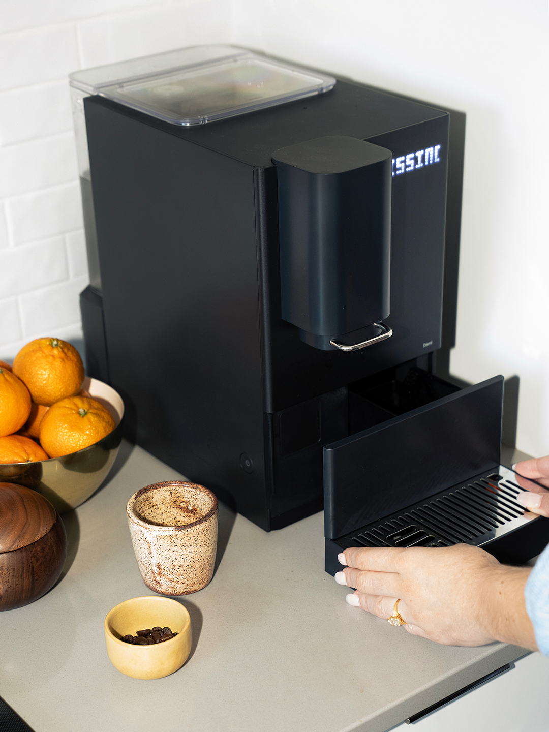 emptying coffee maker tray