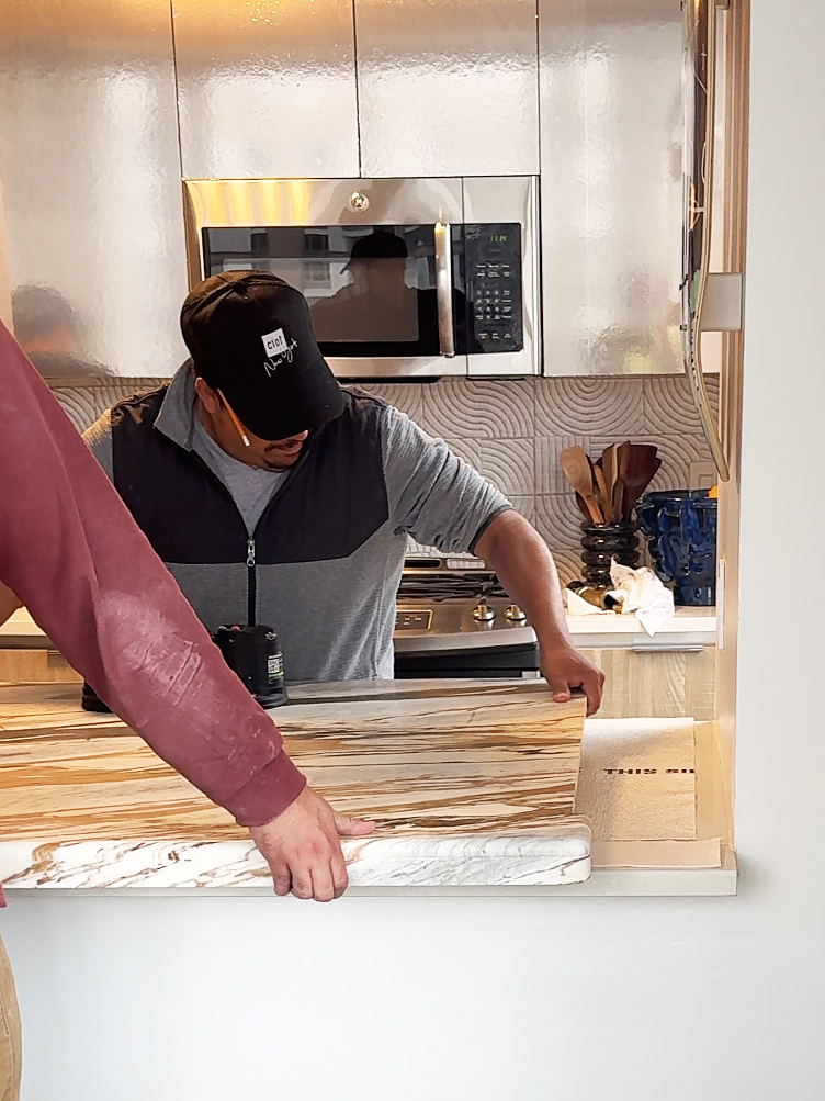 man installing counter