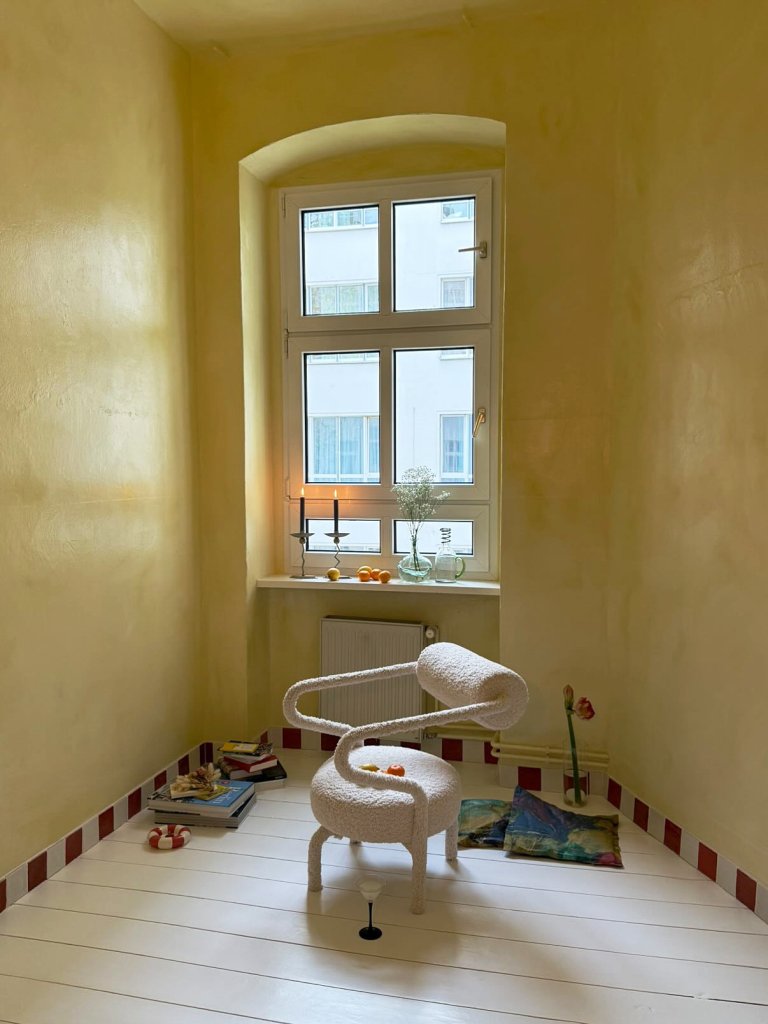 yellow room with red and white square baseboards