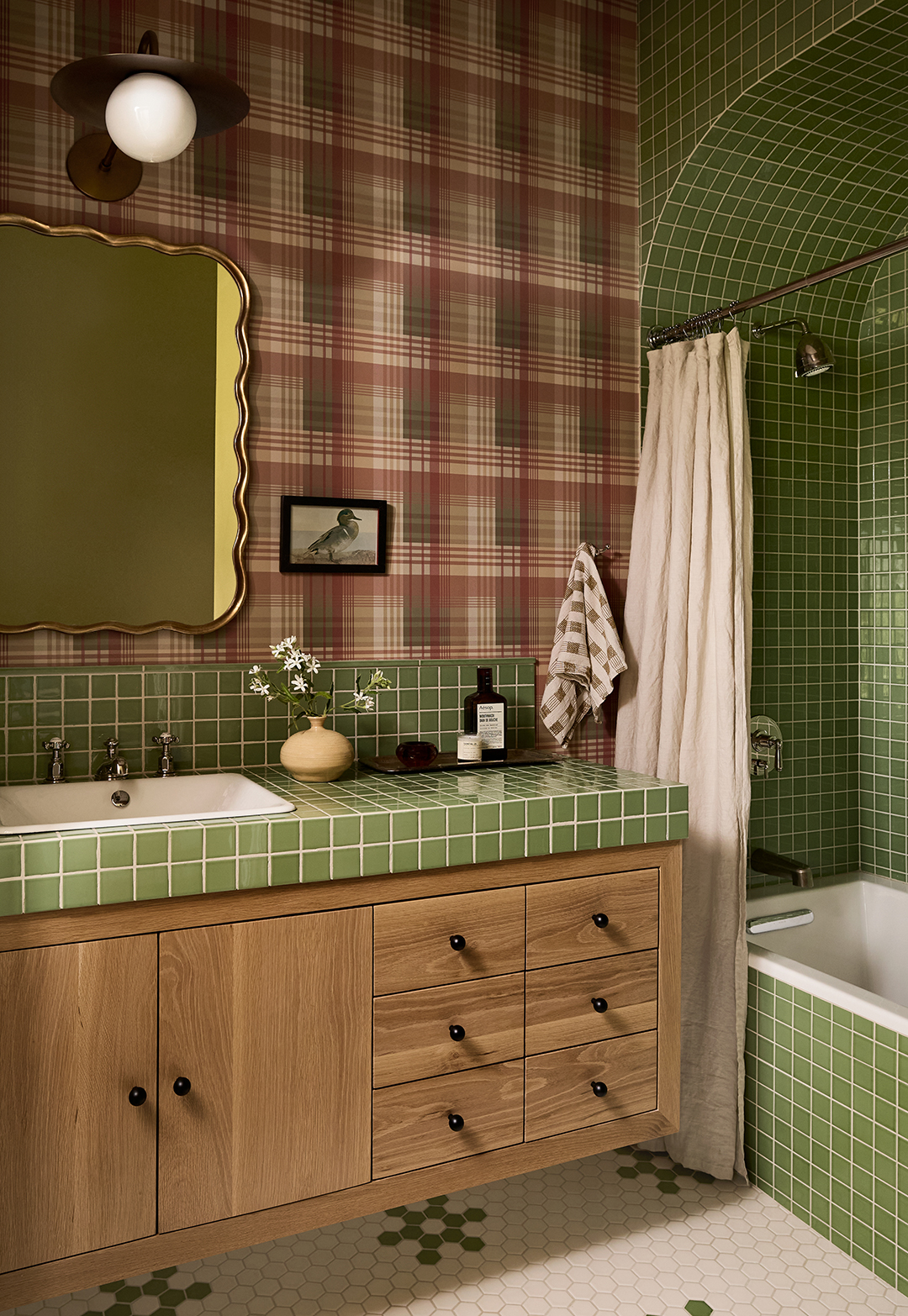 green bathroom with plaid wallpaper